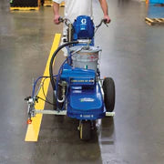 Meon's Graco LineLazer ES 1000 Line Marking Machine spraying yellow line